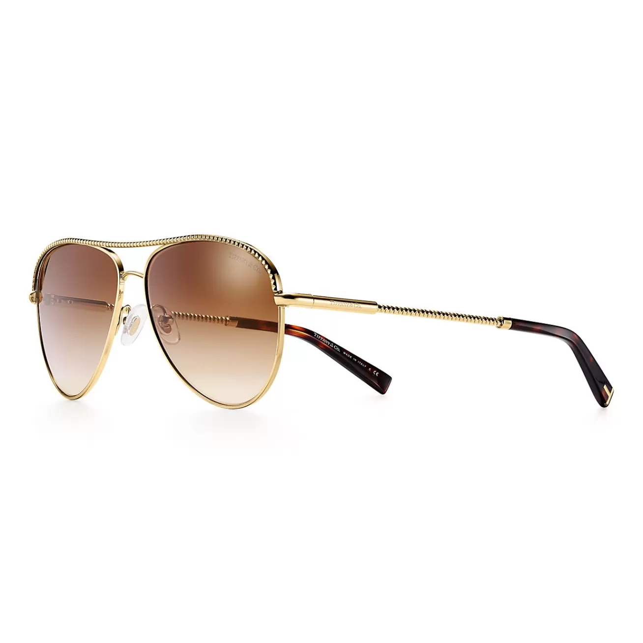 Tiffany & Co. Diamond Point pilot sunglasses in gold-colored metal. | ^ Sunglasses