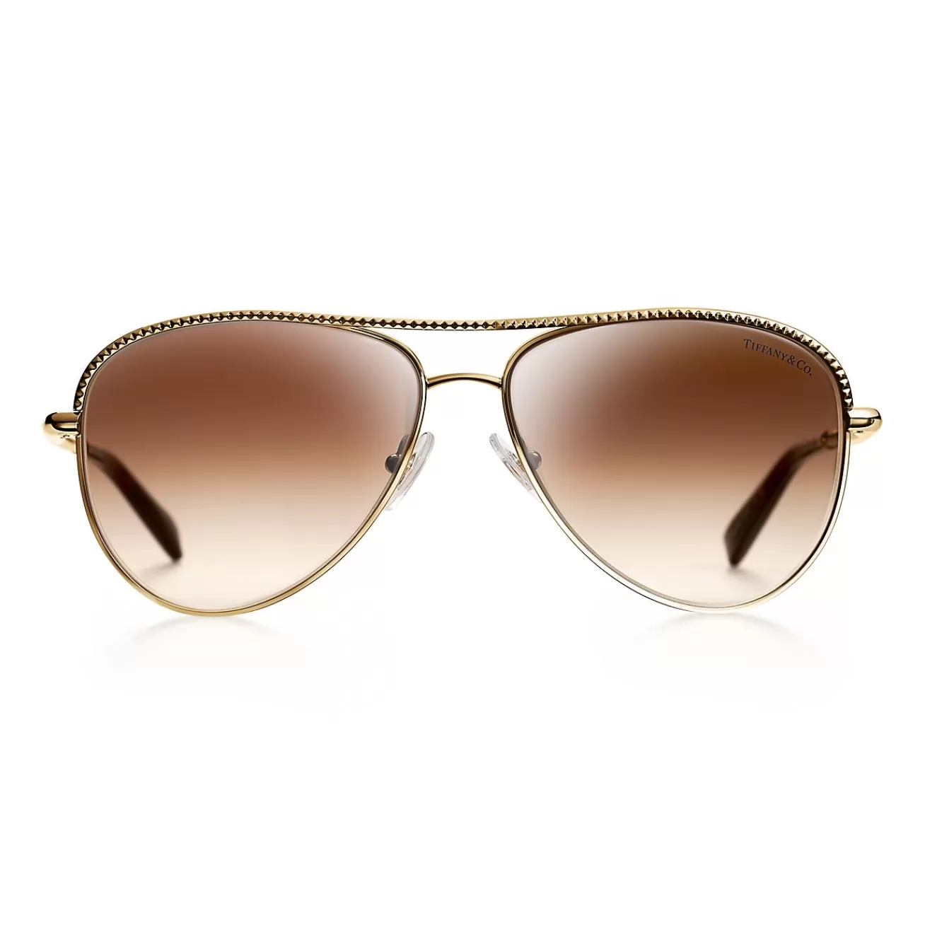 Tiffany & Co. Diamond Point pilot sunglasses in gold-colored metal. | ^ Sunglasses