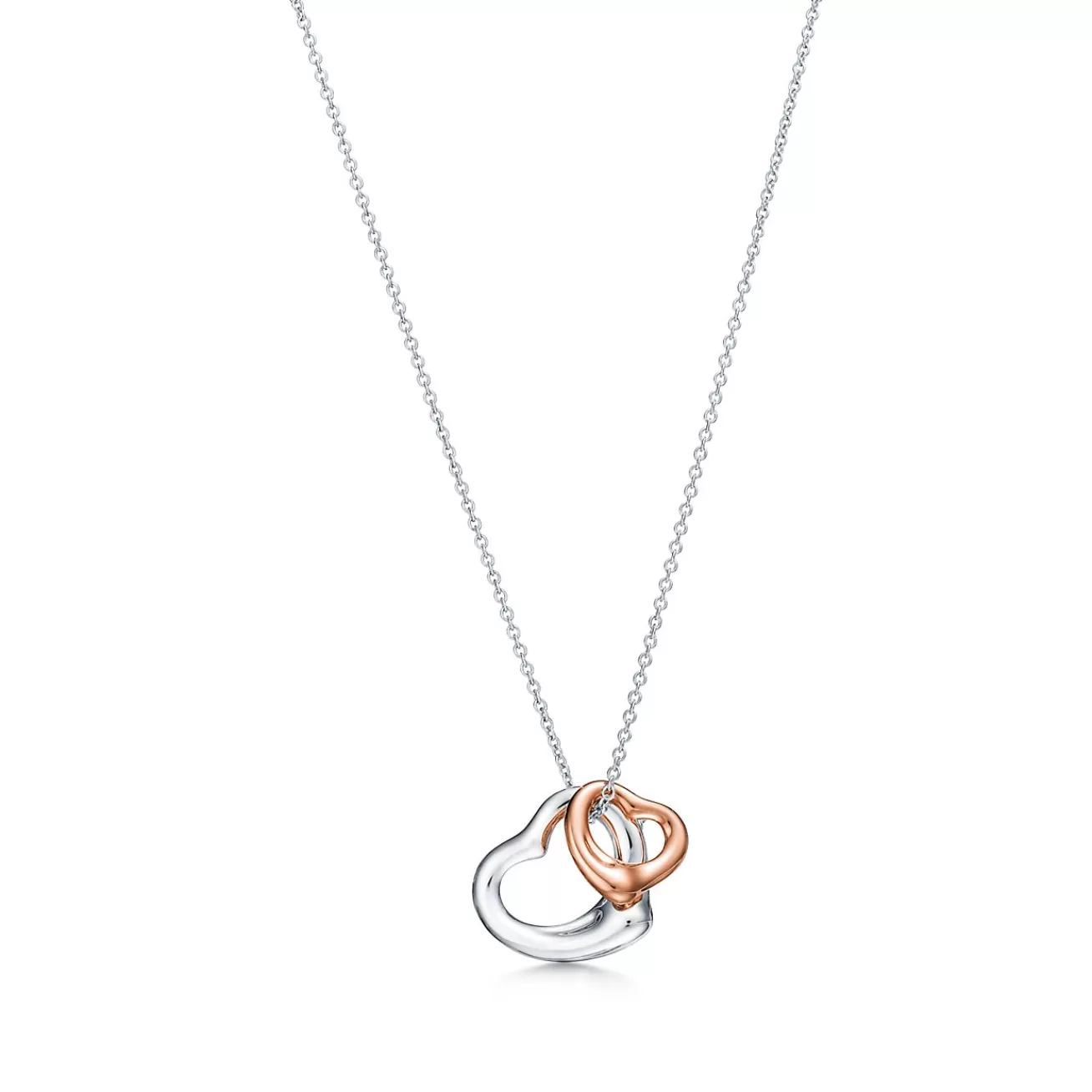 Tiffany & Co. Elsa Peretti® Open Heart pendant in sterling silver and 18k rose gold. | ^ Necklaces & Pendants | Gifts for Her
