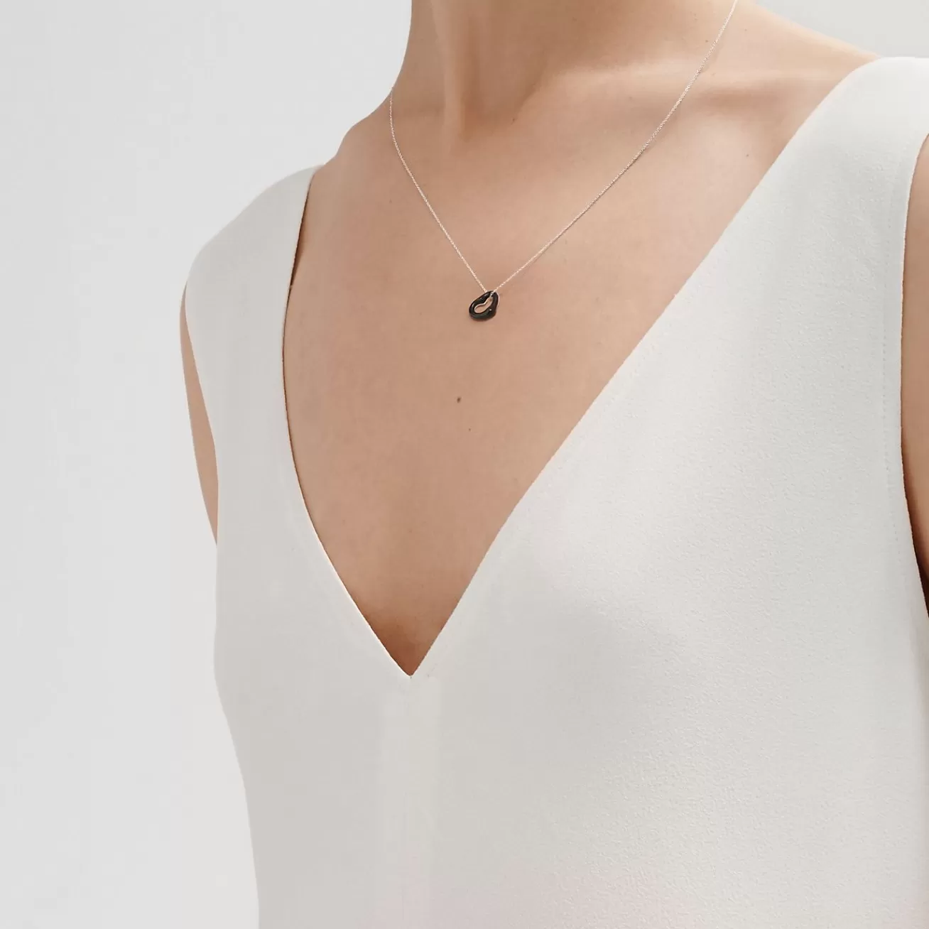 Tiffany & Co. Elsa Peretti® Open Heart pendant of black jade and sterling silver. | ^ Necklaces & Pendants | Sterling Silver Jewelry