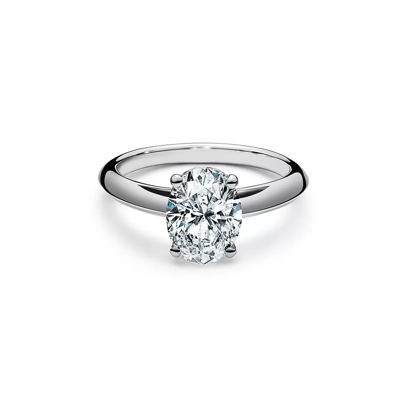 Tiffany & Co. Oval-cut diamond engagement ring in platinum. | ^ Engagement Rings