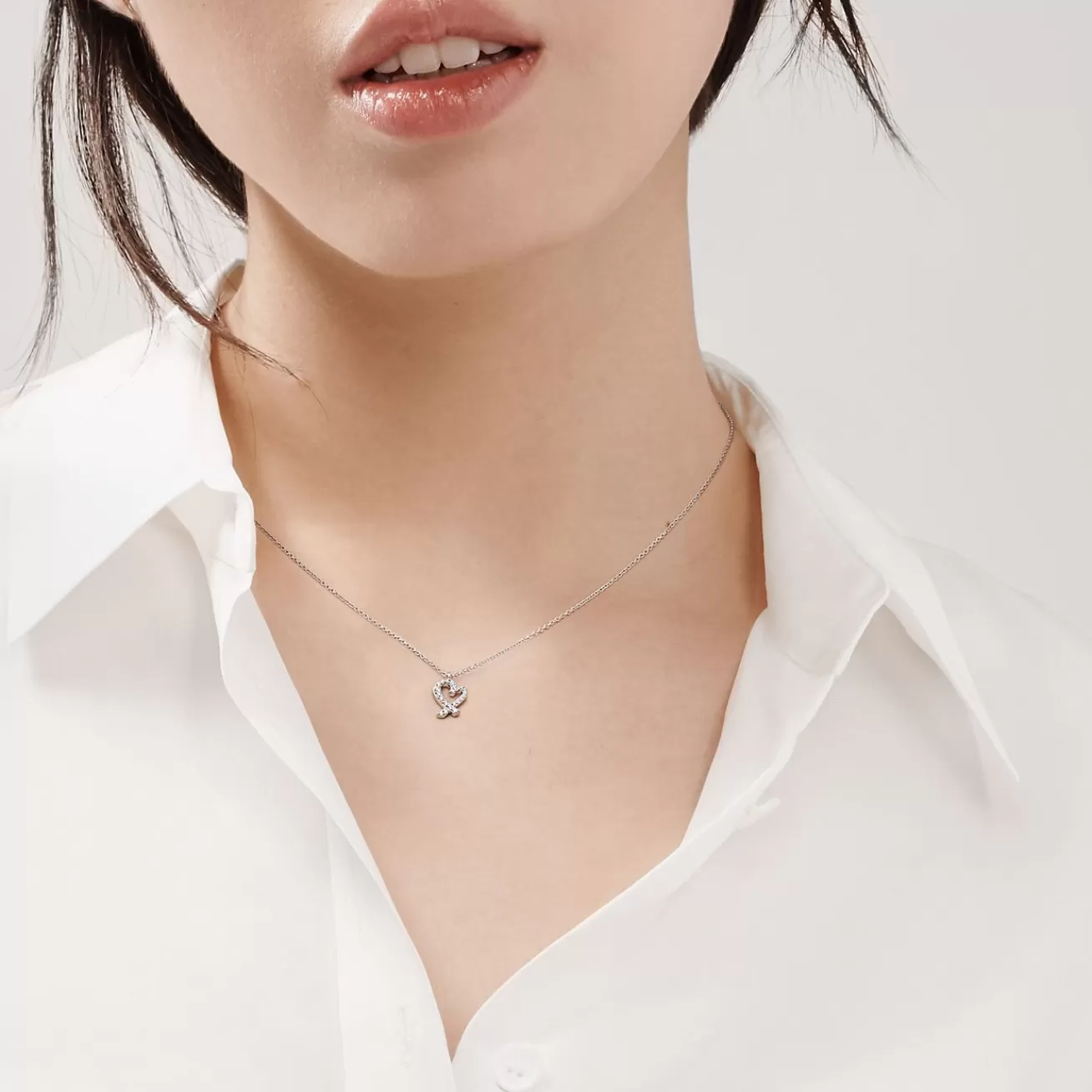 Tiffany & Co. Paloma Picasso® Loving Heart pendant in 18k white gold with diamonds. | ^ Necklaces & Pendants | Diamond Jewelry