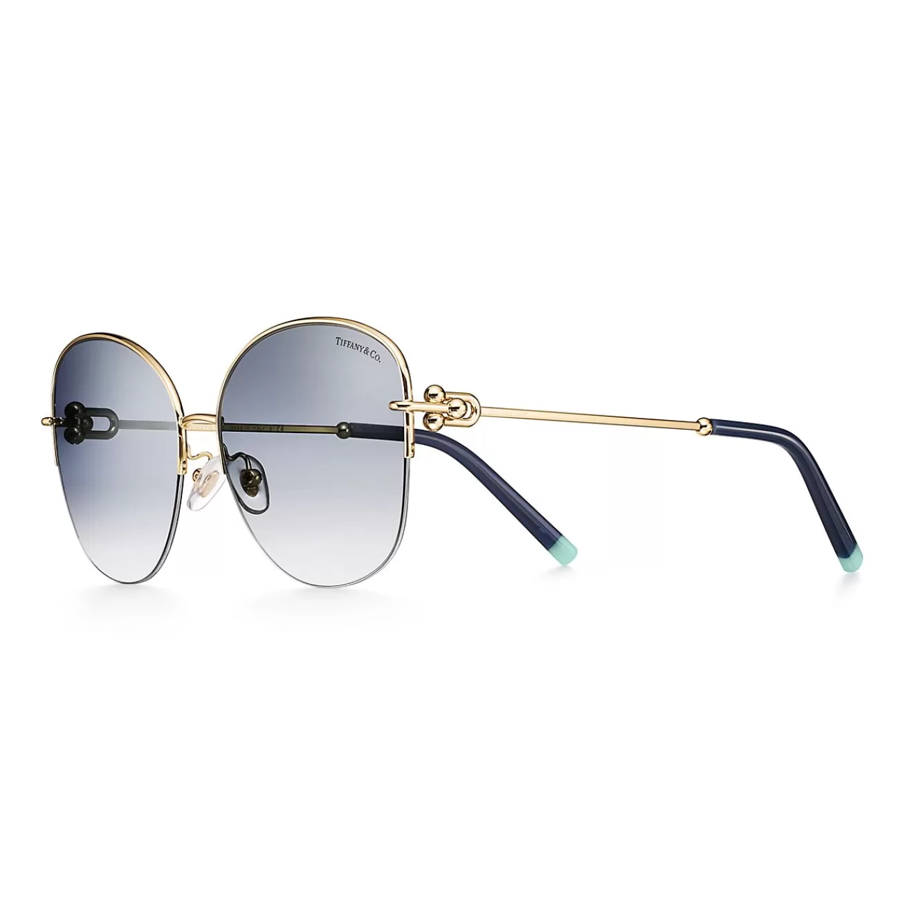 Tiffany & Co. Tiffany HardWear Sunglasses in Pale Gold-colored Metal with Blue Lenses | ^ Tiffany HardWear | Sunglasses