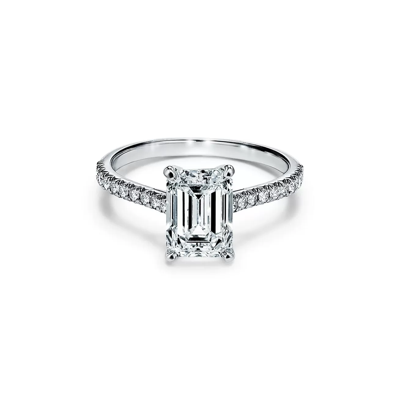 Tiffany & Co. Tiffany Novo® emerald-cut engagement ring with a pavé diamond band in platinum. | ^ Engagement Rings