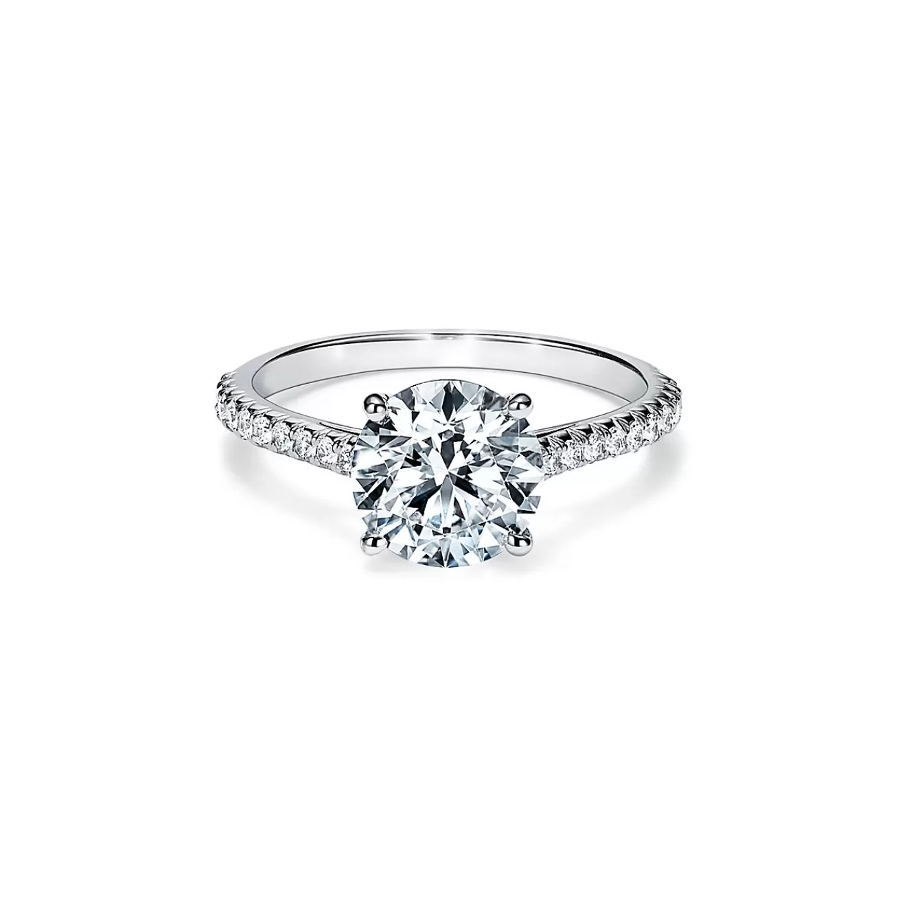 Tiffany & Co. Tiffany Novo® round brilliant engagement ring with a pavé diamond platinum band. | ^ Engagement Rings