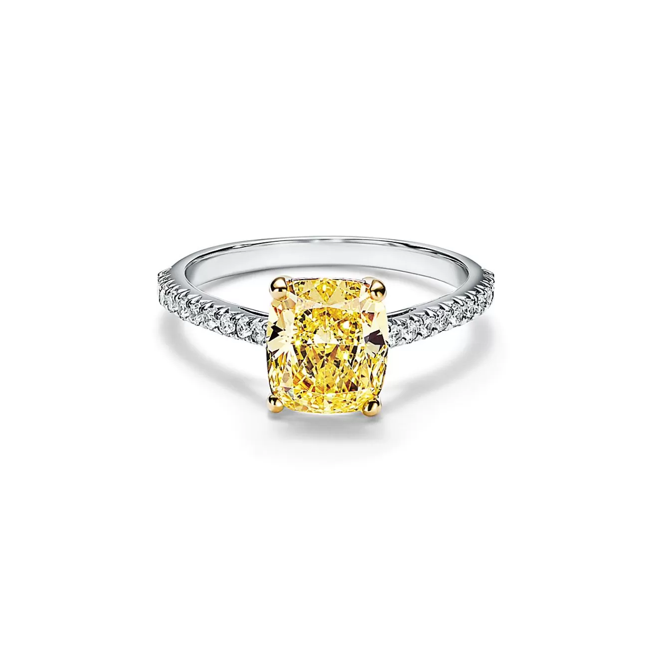 Tiffany & Co. Tiffany Novo® yellow diamond engagement ring with a pavé diamond platinum band. | ^ Engagement Rings
