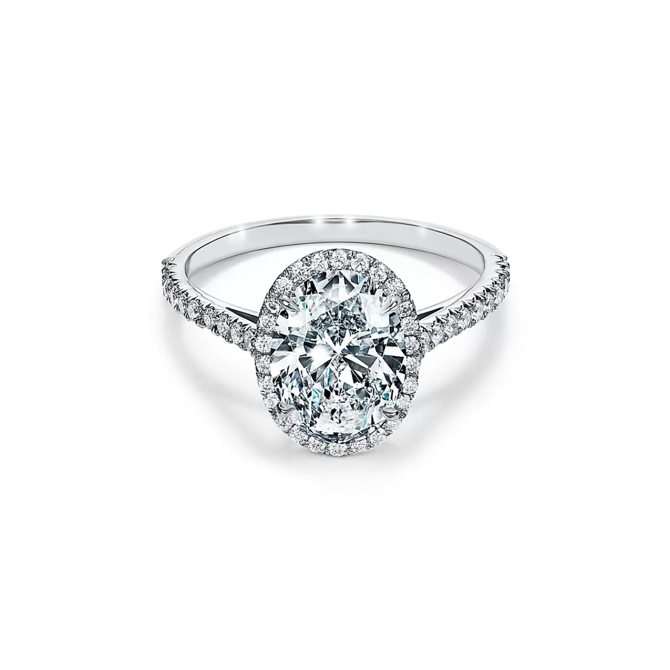 Tiffany & Co. Tiffany Soleste® oval halo engagement ring with a diamond band in platinum. | ^ Engagement Rings
