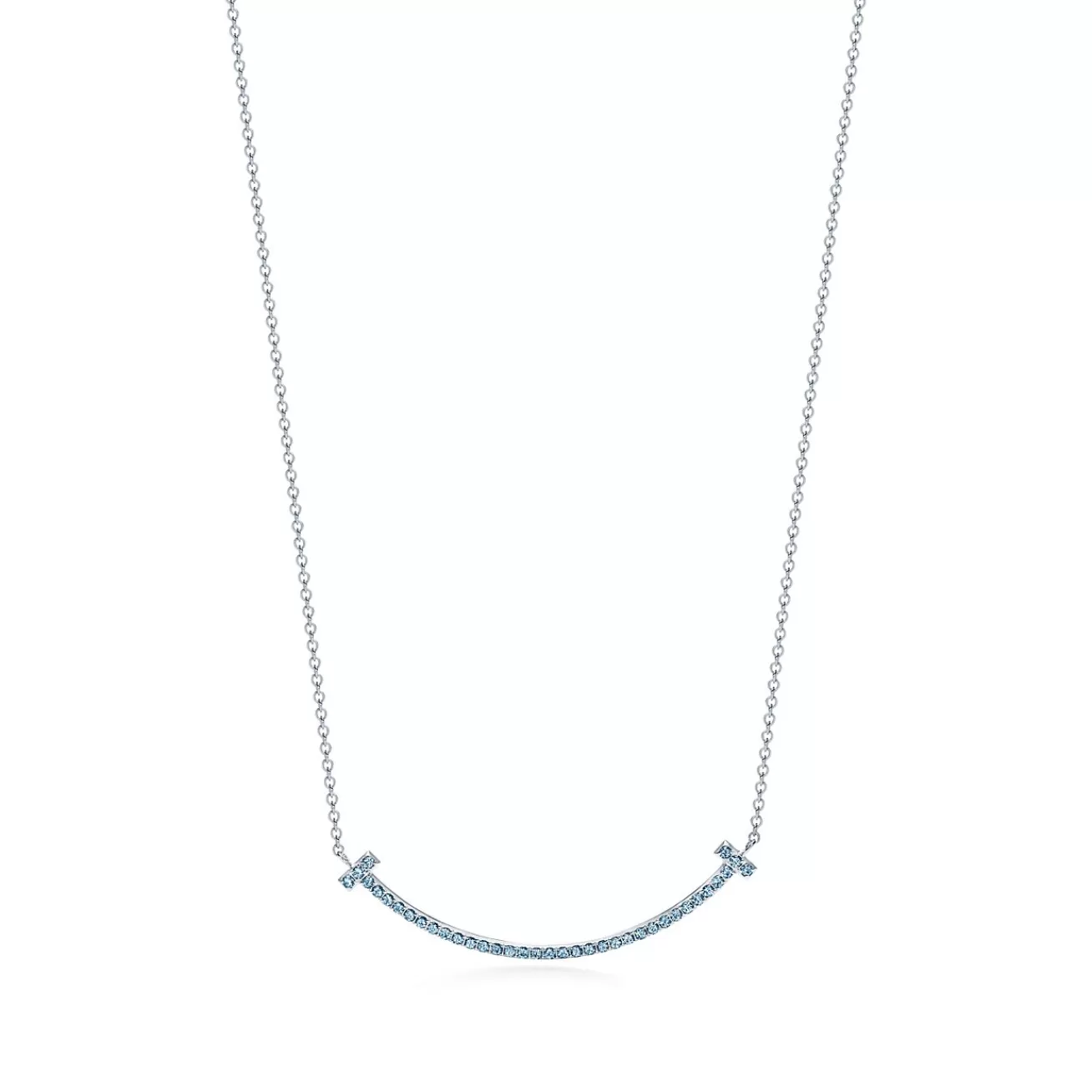 Tiffany & Co. Tiffany T smile pendant in 18k white gold with blue topazes, small. | ^ Necklaces & Pendants | Colored Gemstone Jewelry