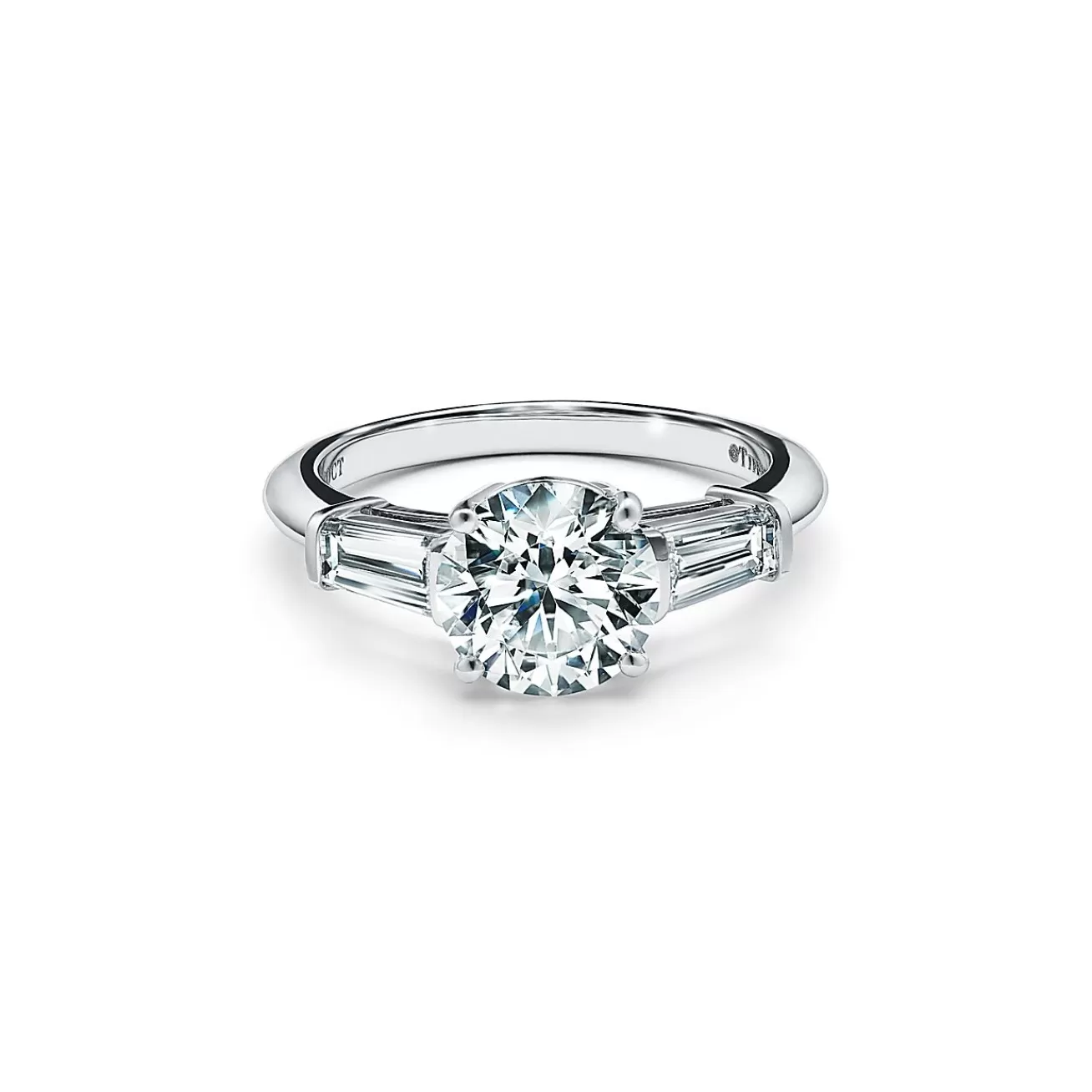 Tiffany & Co. Tiffany Three Stone engagement ring with baguette side stones in platinum. | ^ Engagement Rings