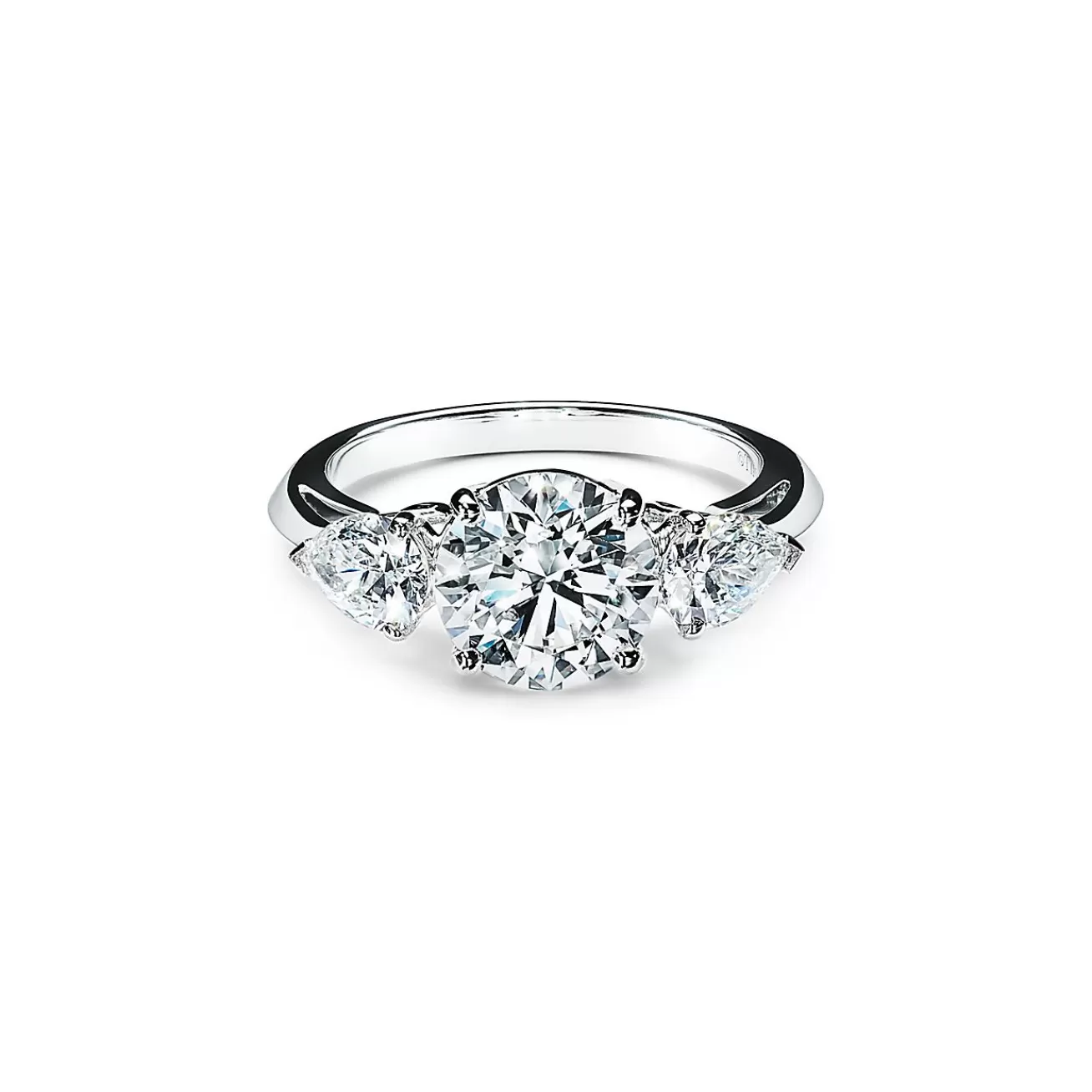 Tiffany & Co. Tiffany Three Stone engagement ring with pear-shaped side stones in platinum. | ^ Engagement Rings