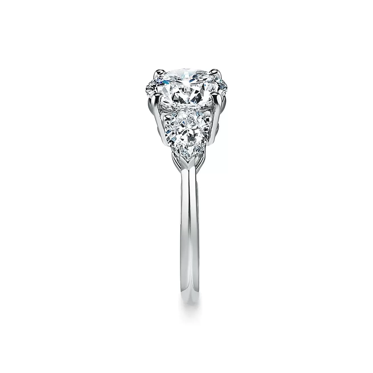 Tiffany & Co. Tiffany Three Stone engagement ring with pear-shaped side stones in platinum. | ^ Engagement Rings