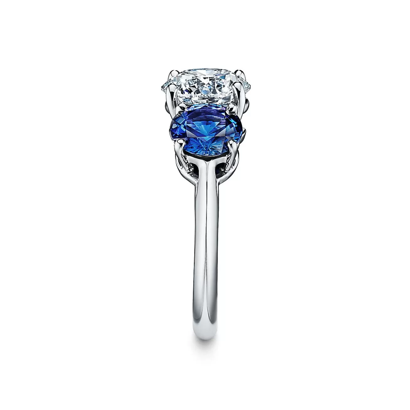 Tiffany & Co. Tiffany Three Stone engagement ring with sapphire side stones in platinum. | ^ Engagement Rings