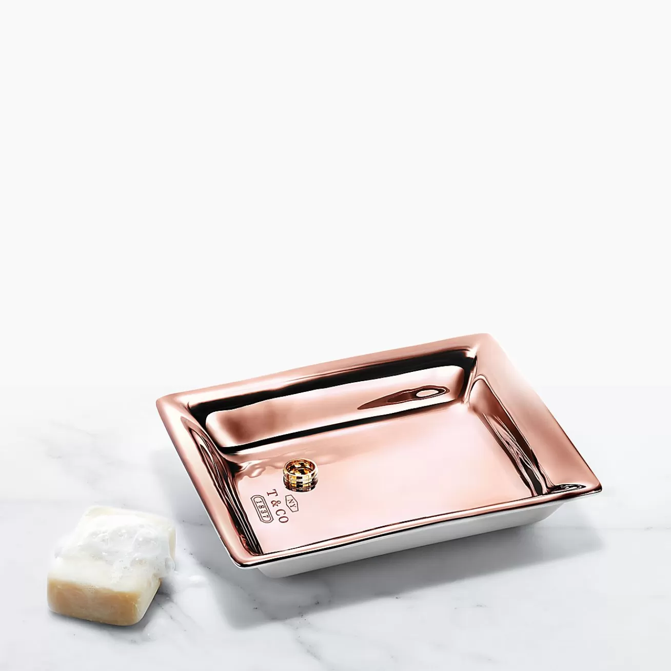 Tiffany & Co. Vide poche in porcelain with a rose gold hand-painted finish. | ^ The Home | Housewarming Gifts
